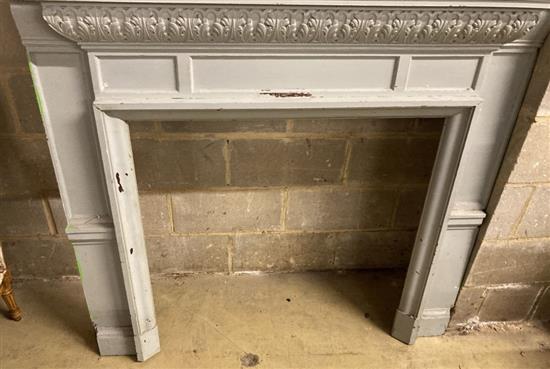 An early 20th century painted pine fire surround with double niche, width 134cm, depth 41cm, height 24cm